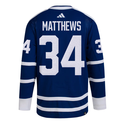 Auston Matthews and Mitch Marner wearing the Leafs Reverse Retro